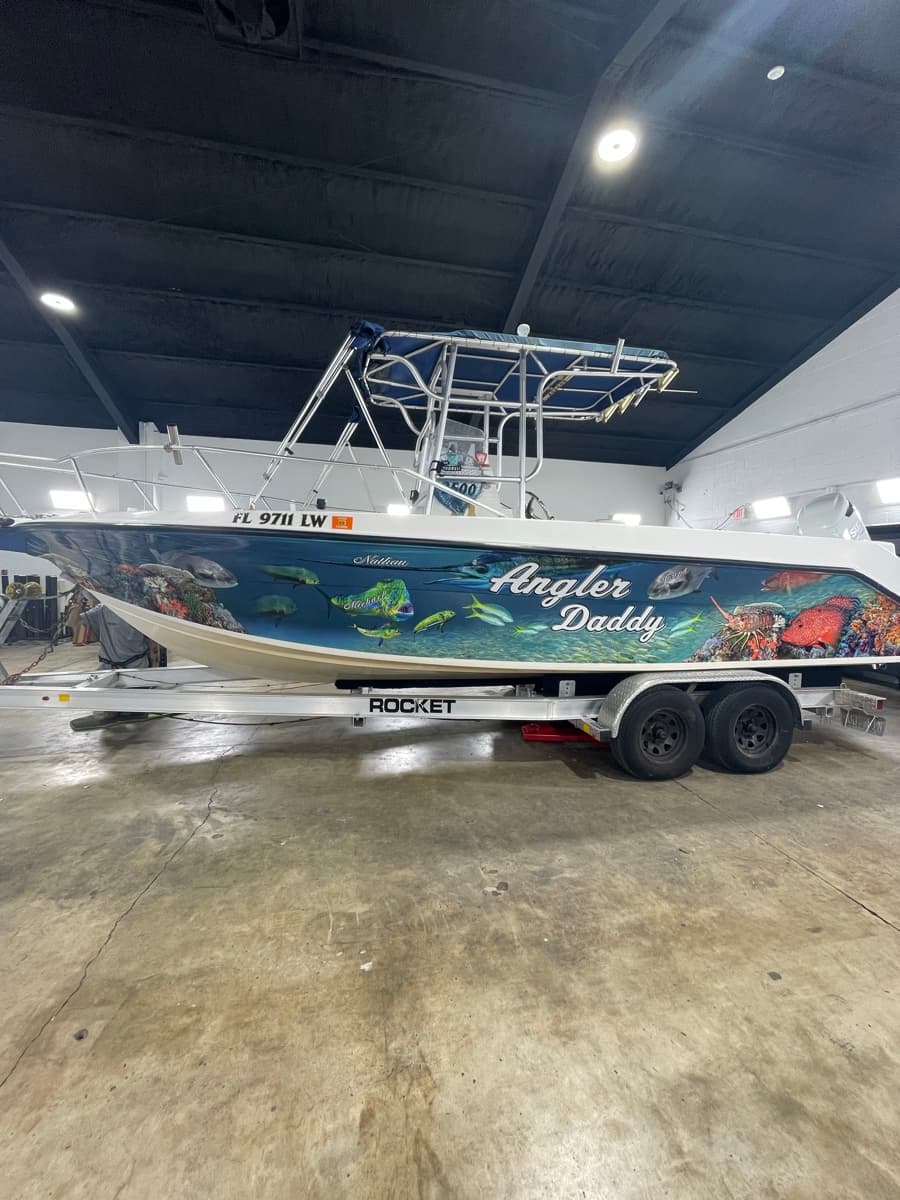 Custom boat graphics Angler Daddy reef wrap by Auto Trim Design Bradenton