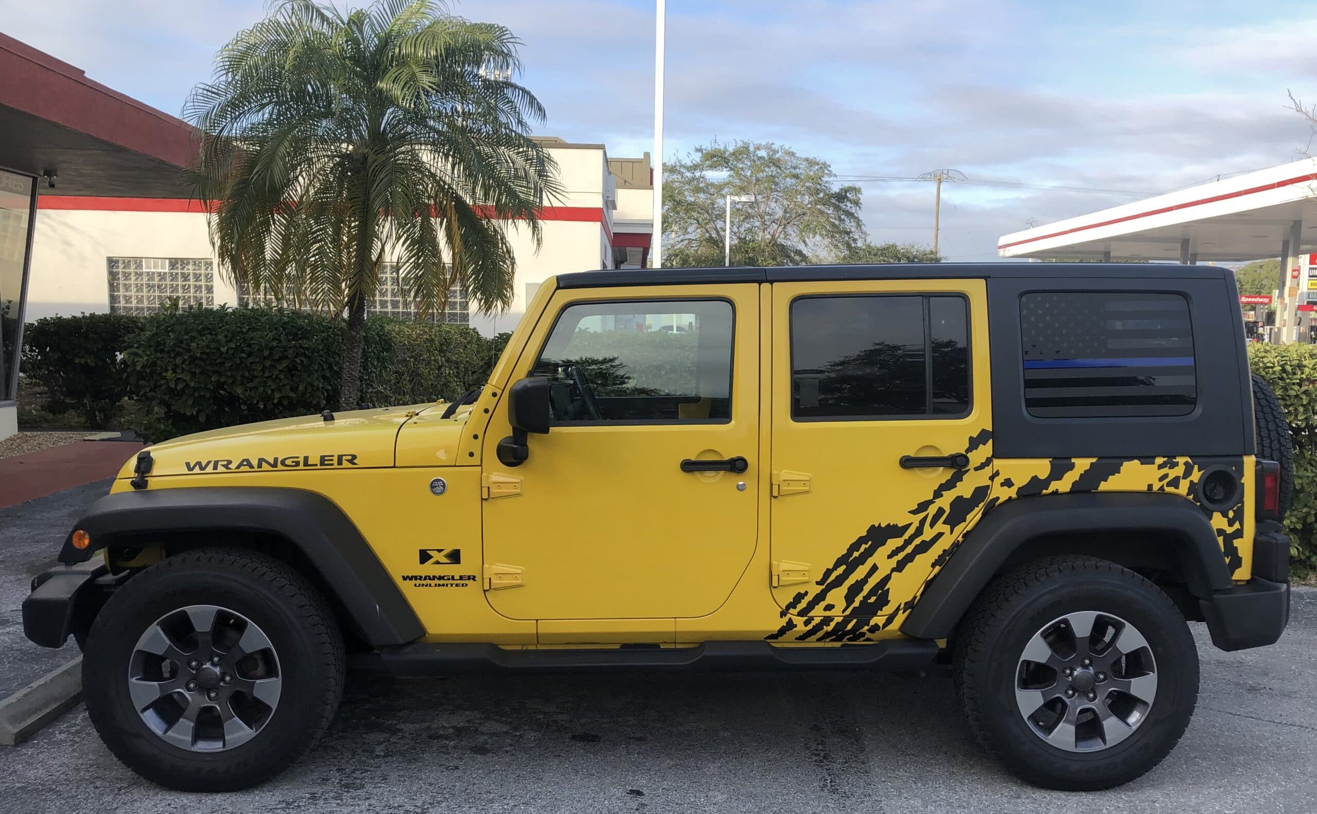 Custom vinyl graphics on custom vehicle by ATD Suncoast