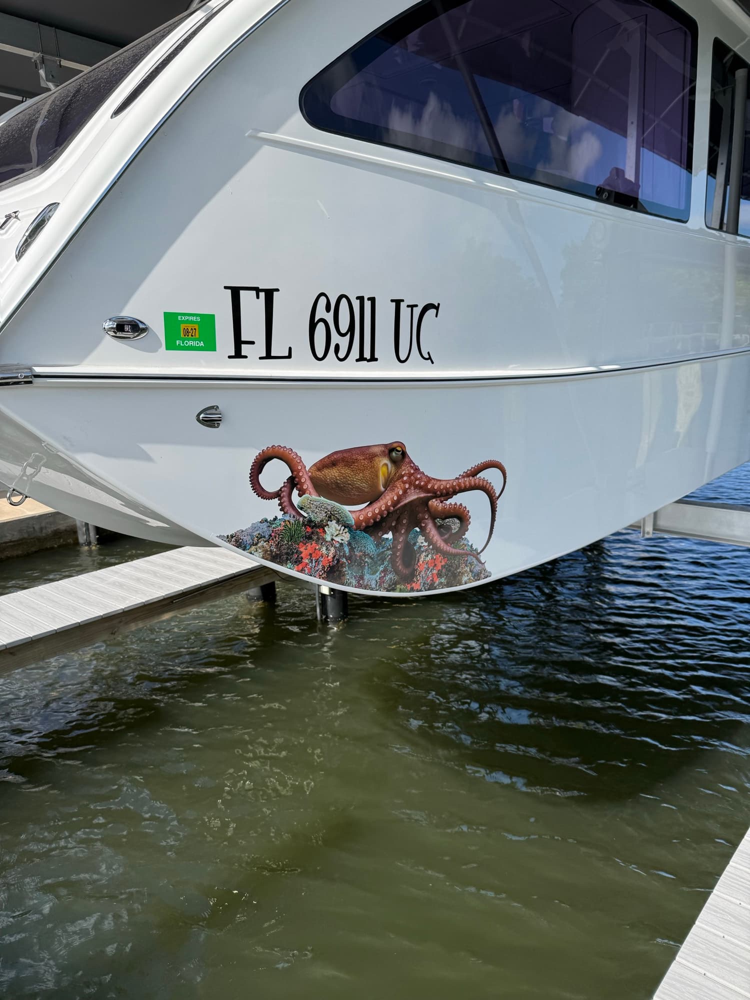 Boat with custom octopus reef graphic by ATD Suncoast