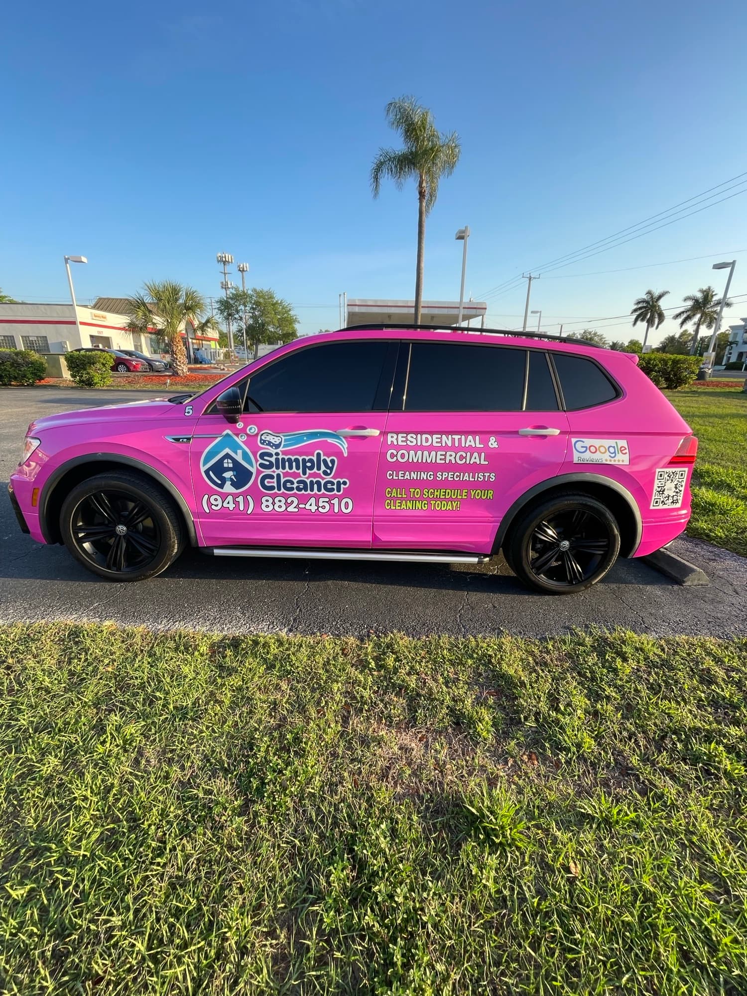 Simply Clean pink full car wrap by ATD Suncoast